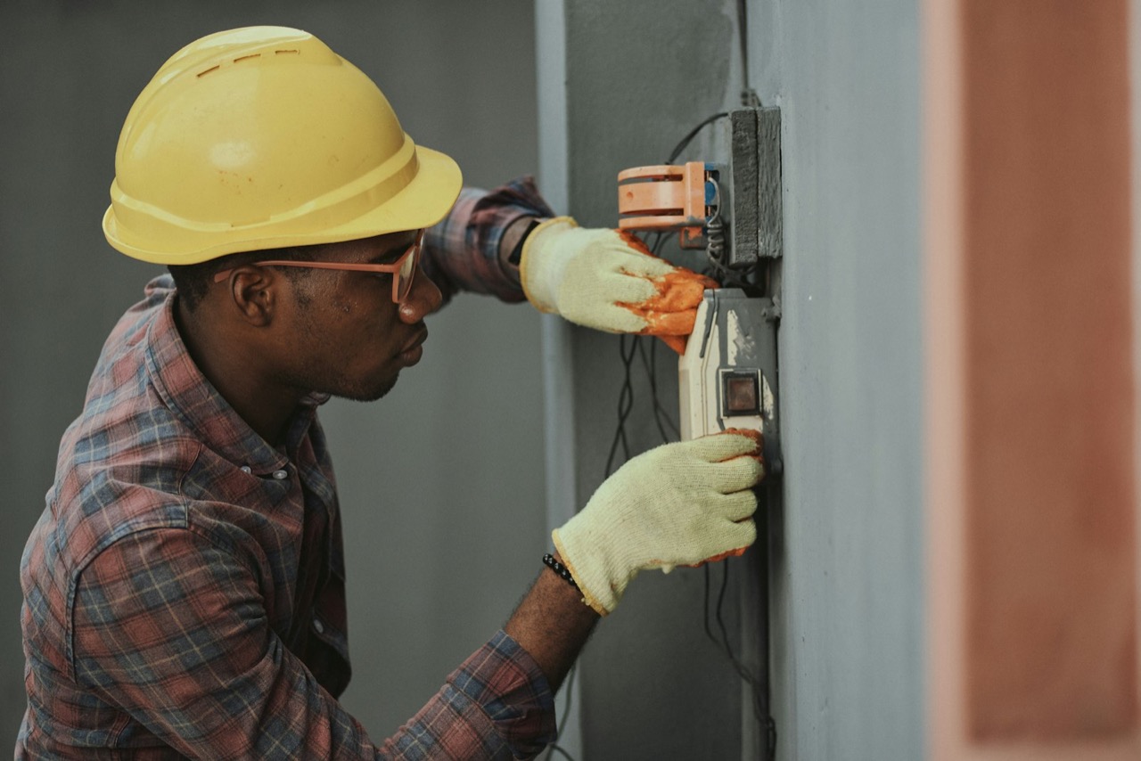 A service professional installing equipment on site