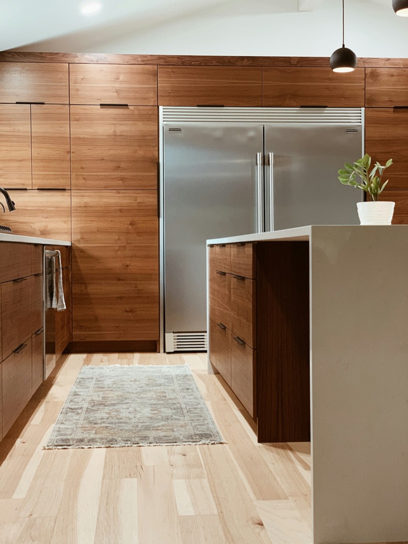 A modern kitchen with a large stainless steel refrigerator
