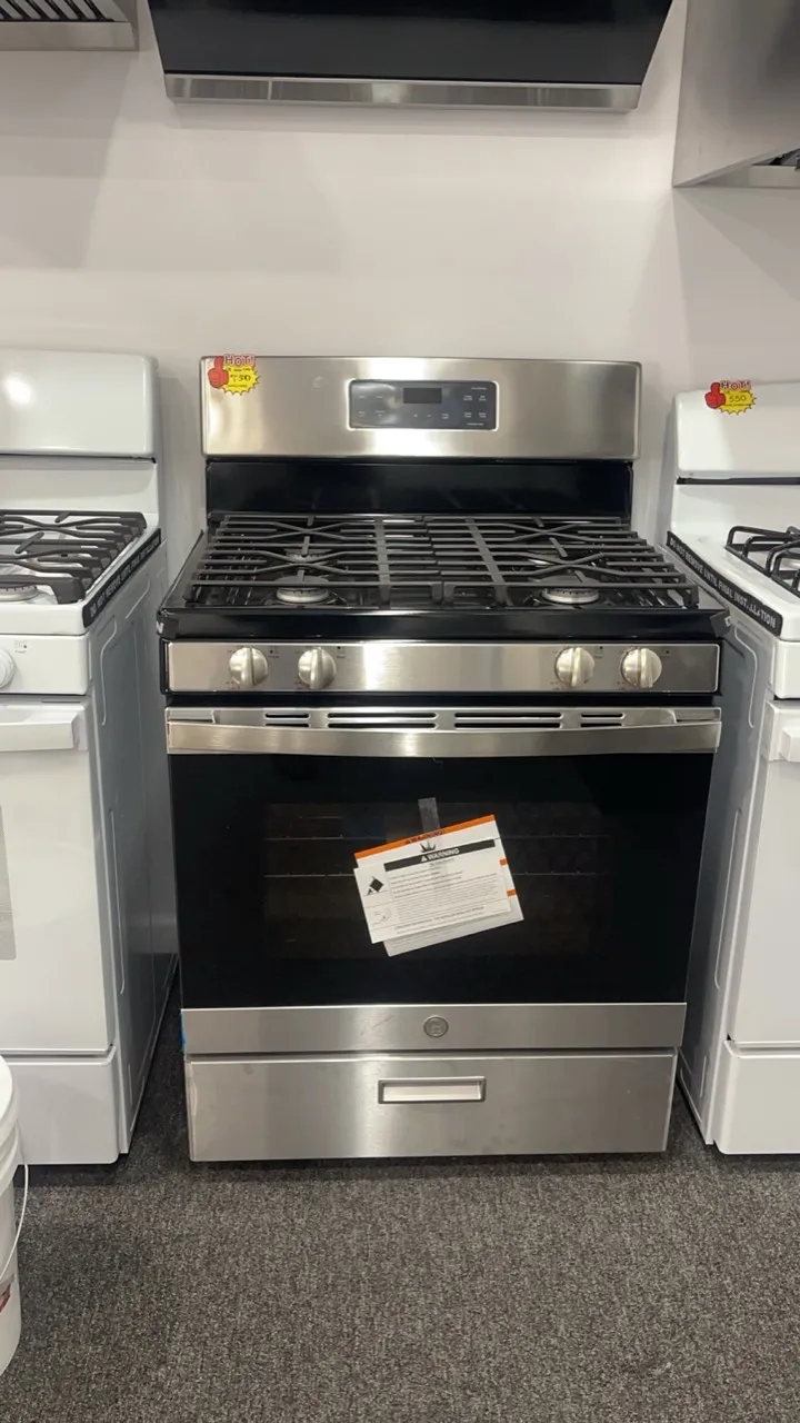 GE stainless-steel five-burner gas range on display in the Kings AC Supply appliance showroom